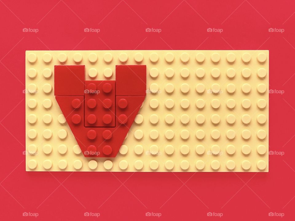 Red brick blocks in shape of the heart. Valentines day concept.