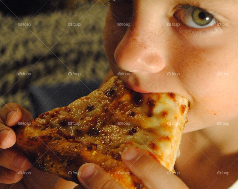 Boy enjoying pizza