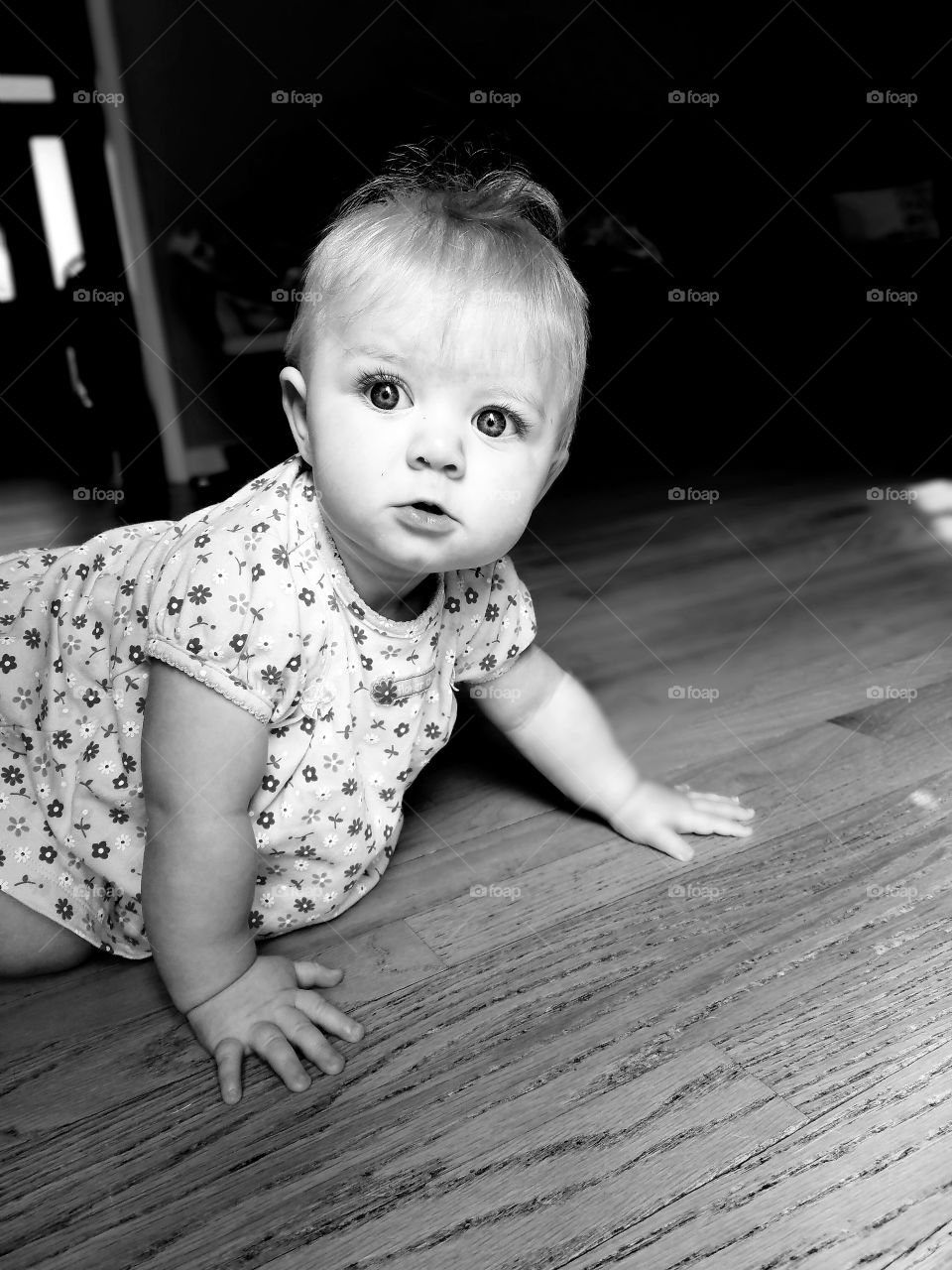 Little girl crawling on floor