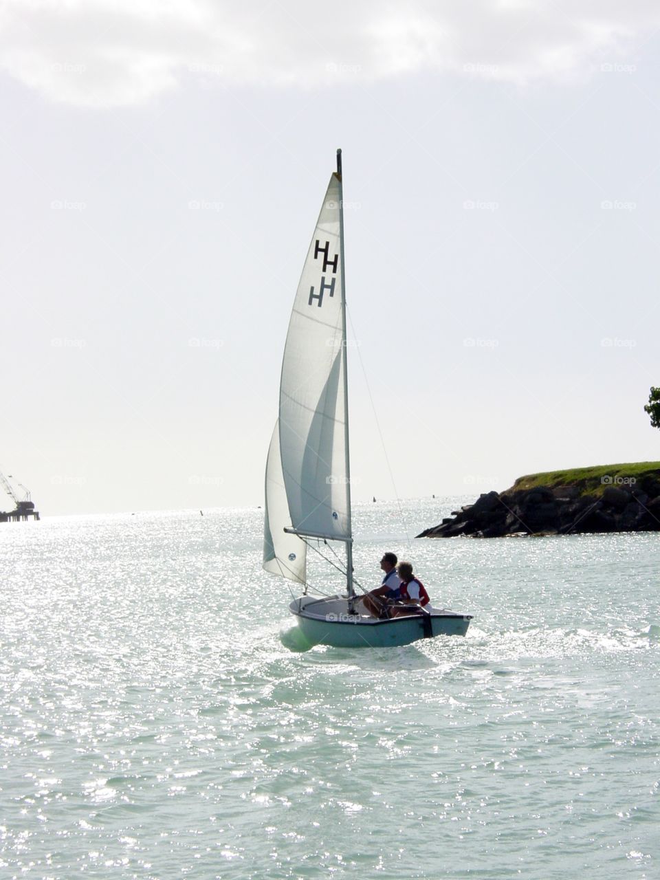 Two people in a sailboat 