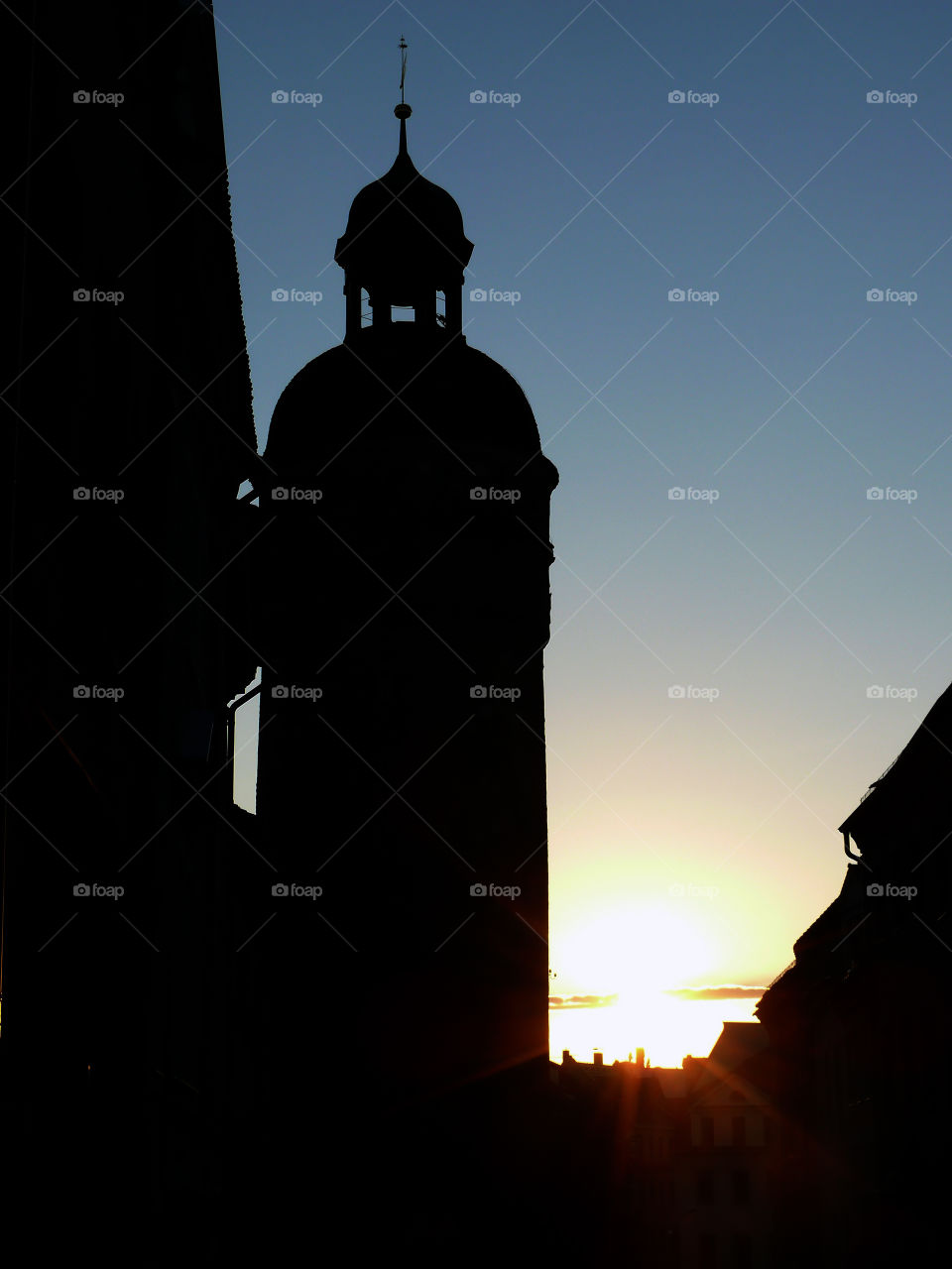 Silhouette of cityscape against sunset sky in Görlitz, Germany.