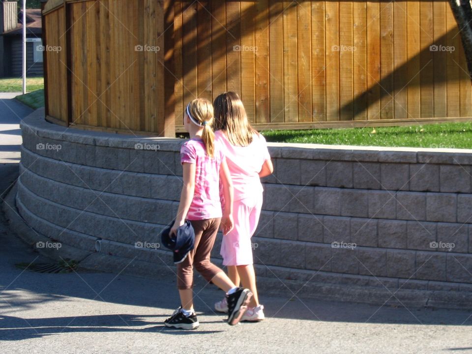 Middle school girls walking home. School girls walking home, best friends