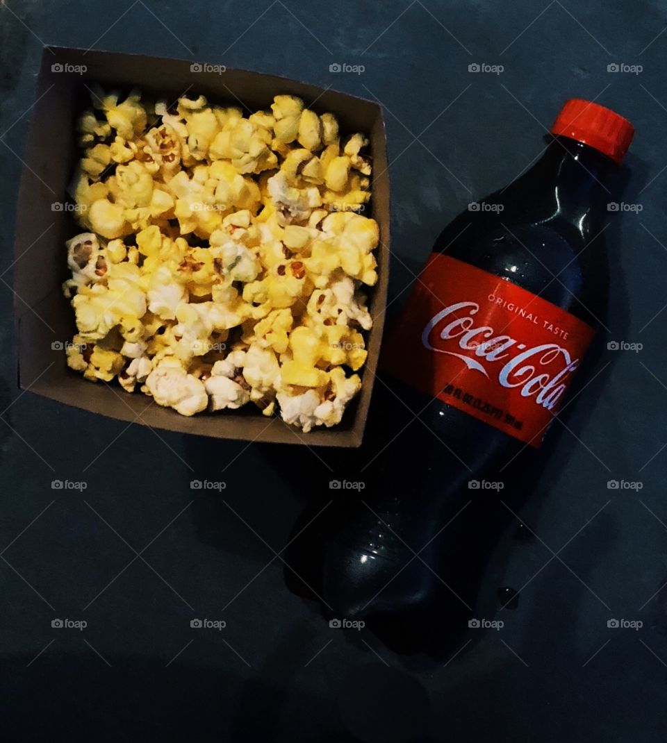 Enjoying my Coke with some butter popcorn 