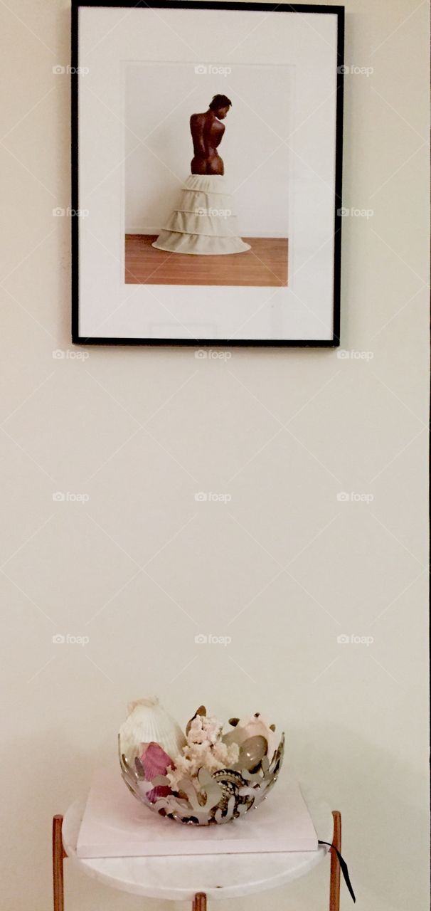 A photo and some decorative shells I keep in my living room