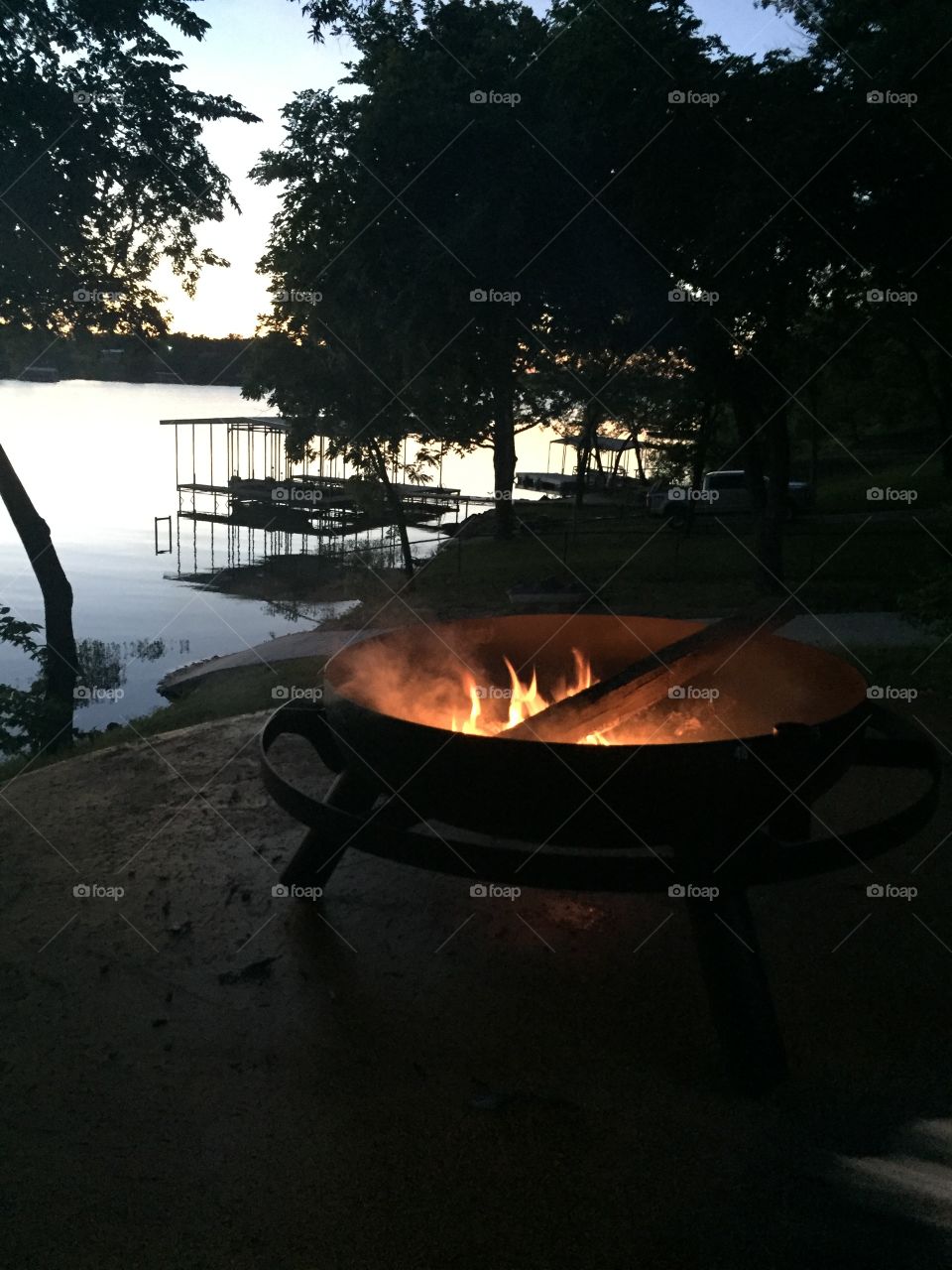 Evening fire by water edge