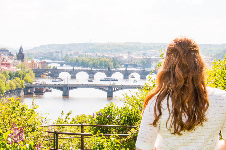 Woman looking out over Prague 