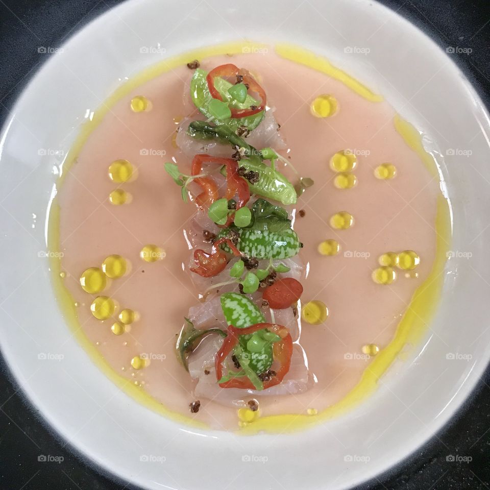 Hamachi crudo with olive oil and herbs