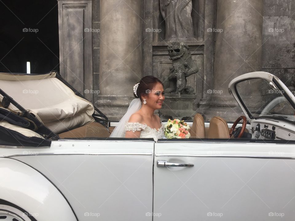 A bride in a wedding car