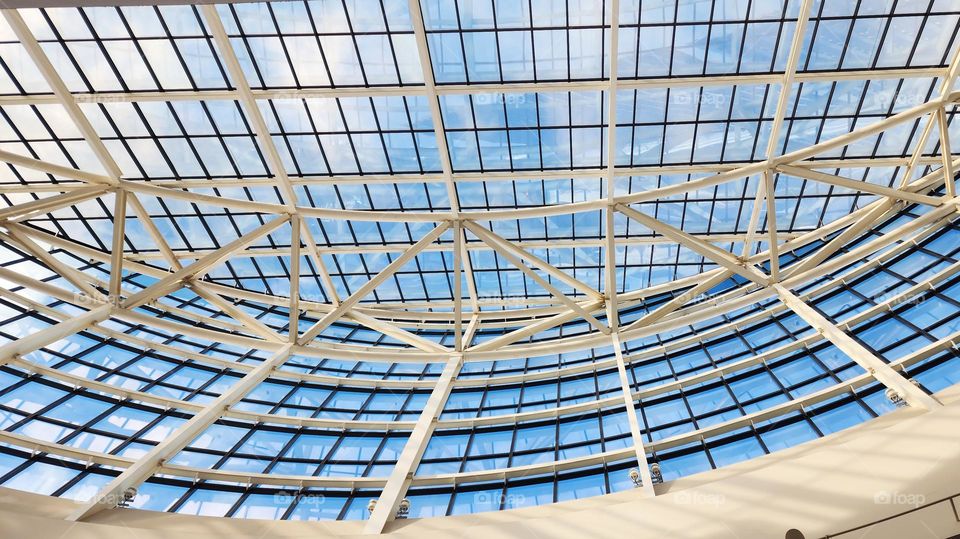 A convention center in Oregon boasts impressive architectural shapes with its many windows offering sky views