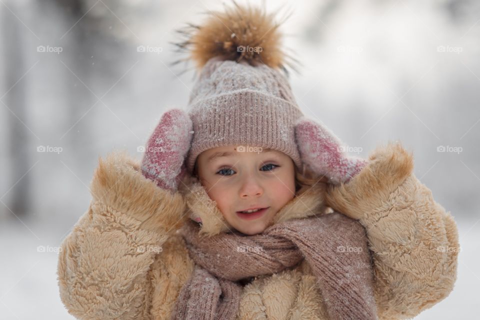 Little girl in a winter park