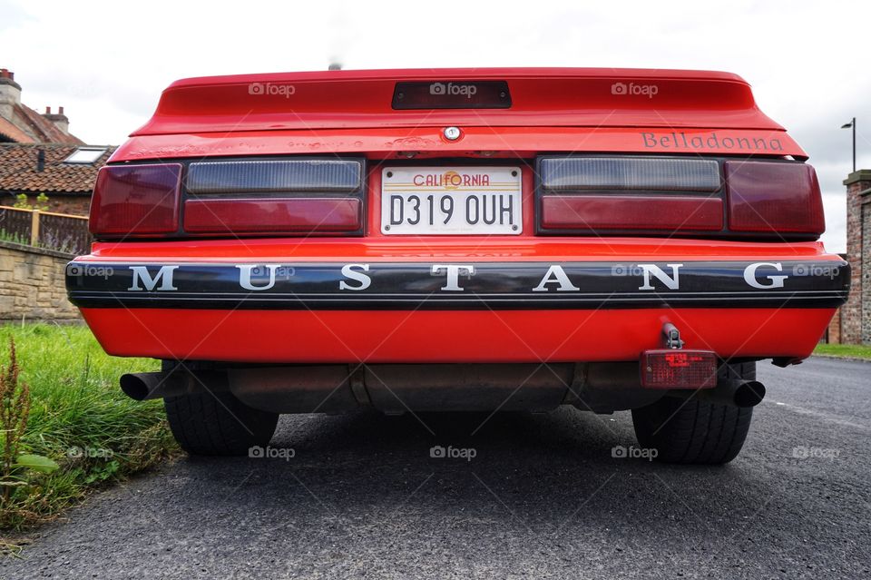 Rear of a bright red MUSTANG car snapped in the  UK ... 