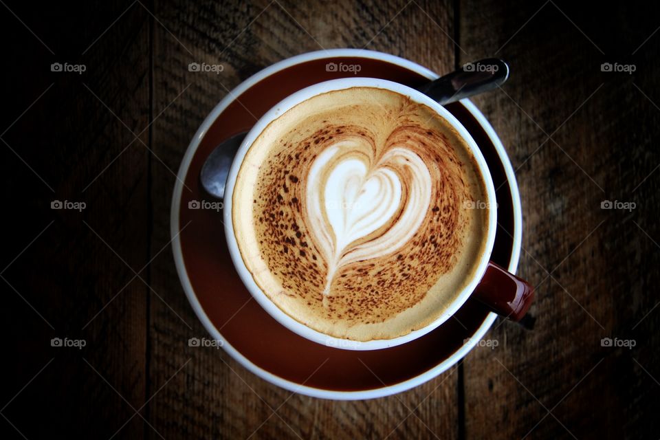 Elevated view of heart shape on coffee
