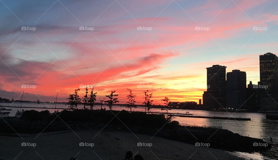 Brooklyn Bridge Park with sunset and NYC skyline