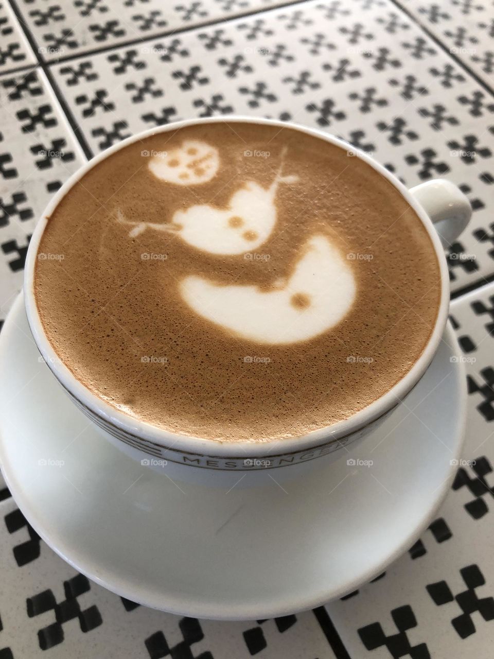 Cup of coffee with a snowman 