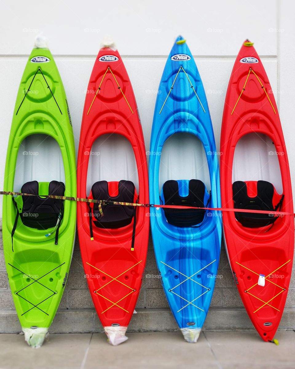 Green blue and red kayaks