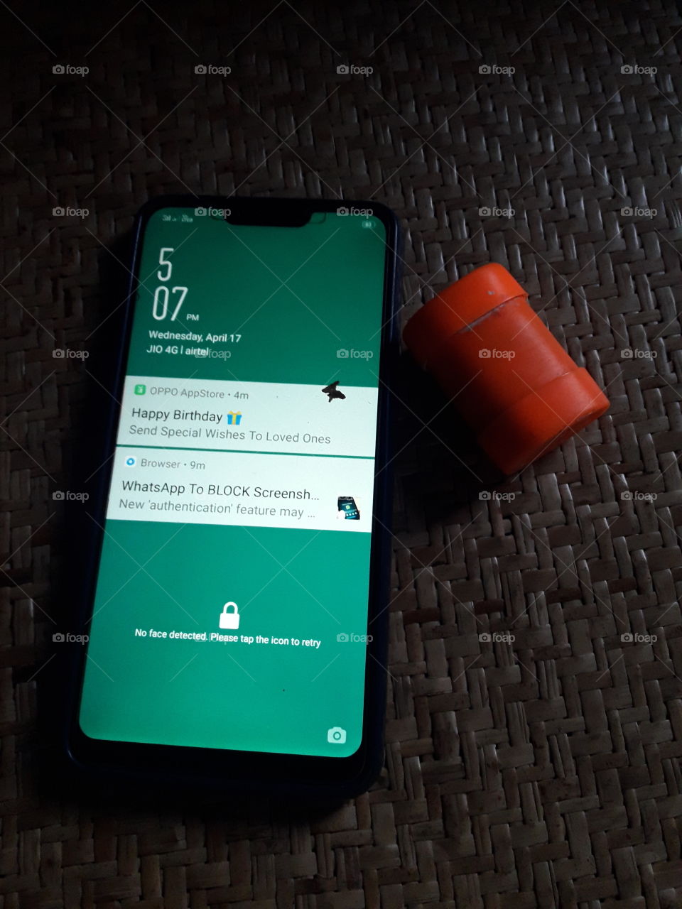 Mobile phone and tambaco container.