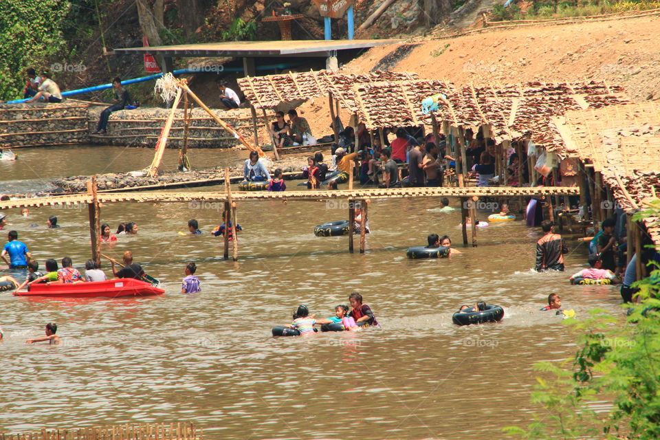 People swim in the river to cool off and have fun.