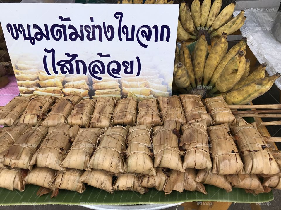 Local dessert from southern Thailand made of grilled sticky rice stuffed with banana