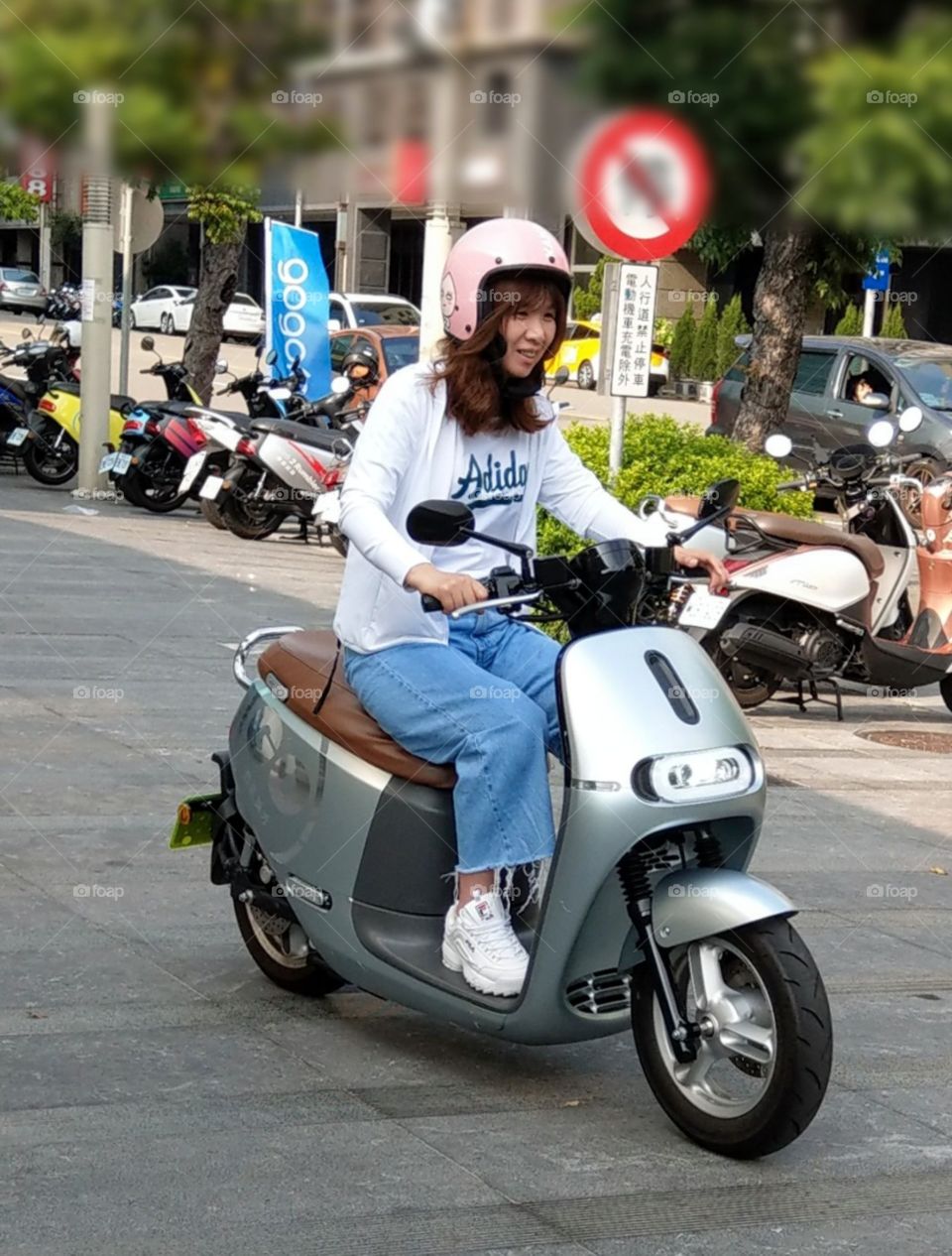 From A to B: riding a new electric motorcycle(or electric skooter), very happy to go to my destination.