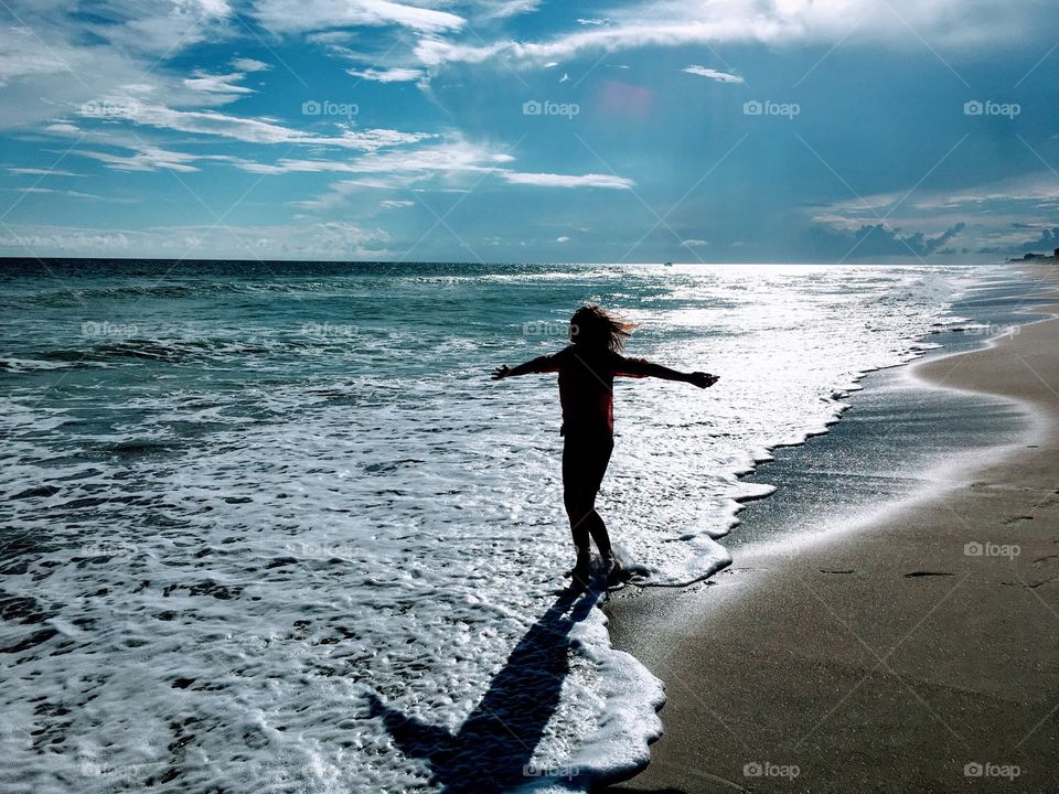 Silhouette of person at sea