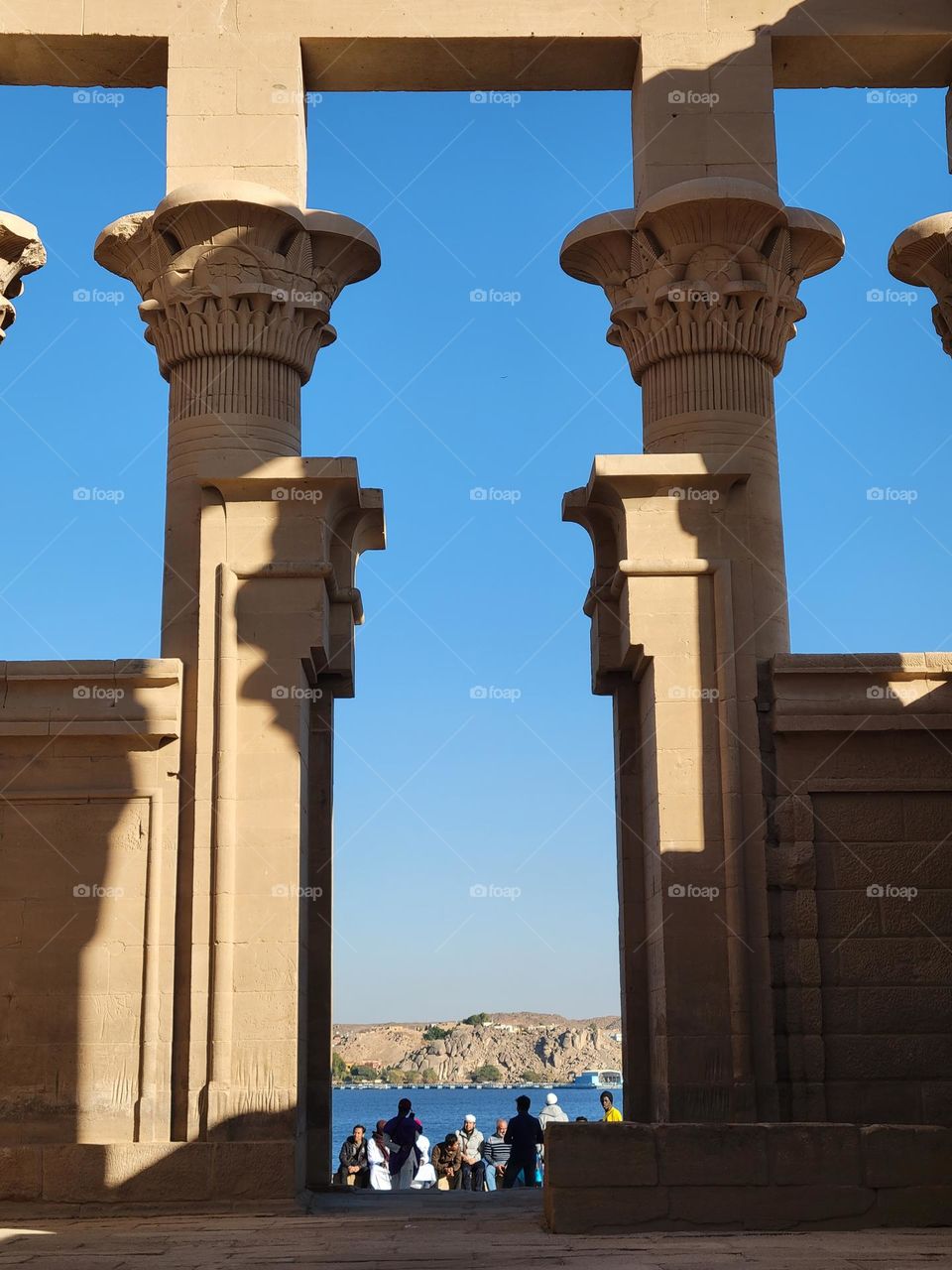 Philae Temple Aswan Egypt - sunny day, people praying together