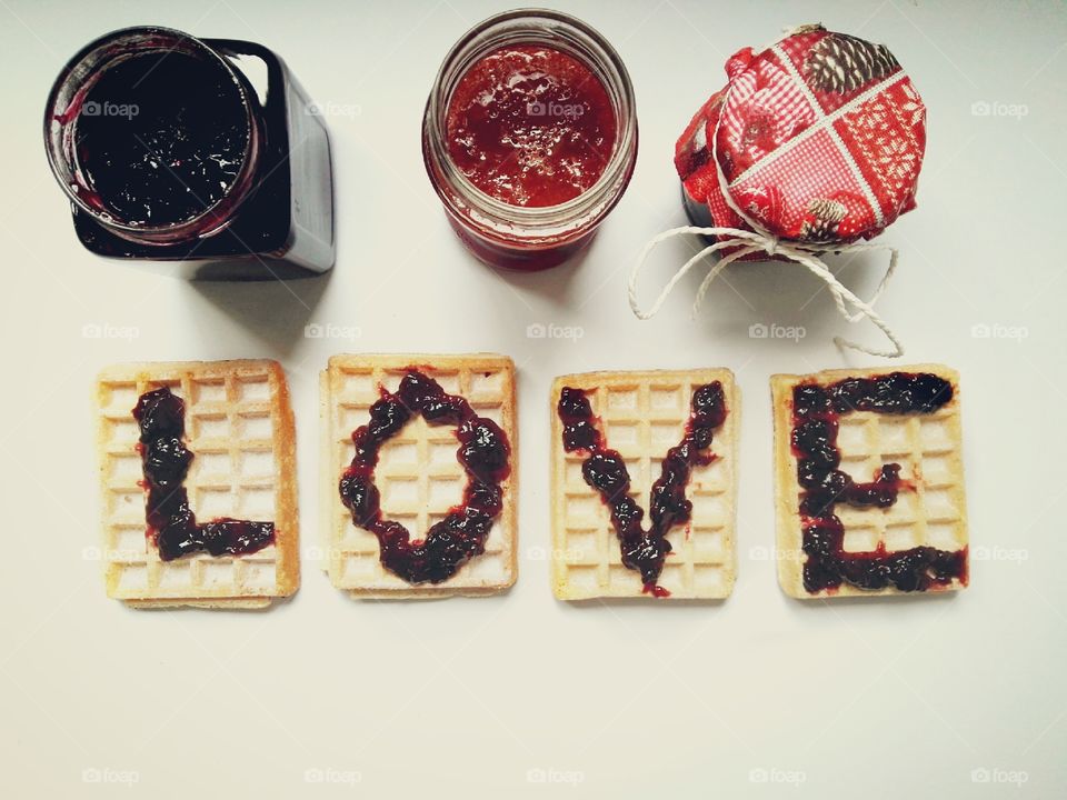 jars with homemade jam and waffles