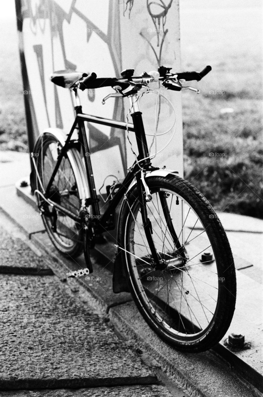 Surly Long Haul Trucker parked under the bridge, shot on Kodak Tri-X 400 at 800 with Pentax K1000 and SMC-M 50mm f1.7
