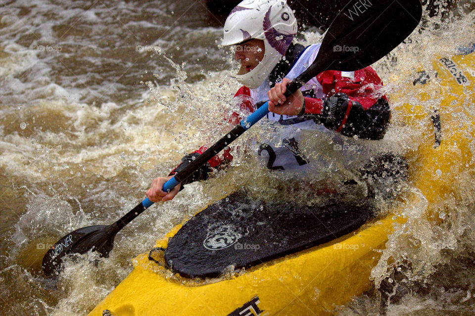 Helsinki, Finland -  April 17, 2016: Unidentified racer at the annual iceBREAK whitewater kayaking competition at the Vanhankaupunginkoski rapids in Helsinki, Finland. 