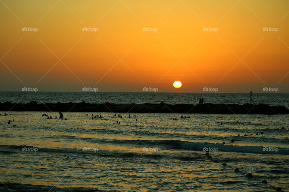 tel aviv beach. people swiming in the sea