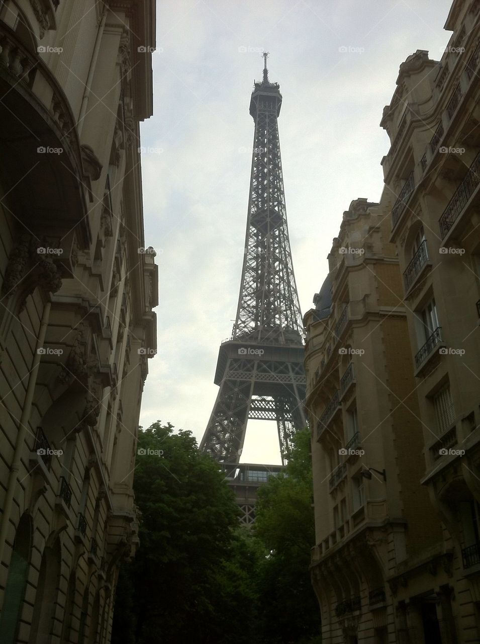 Eiffel Tower between buildings