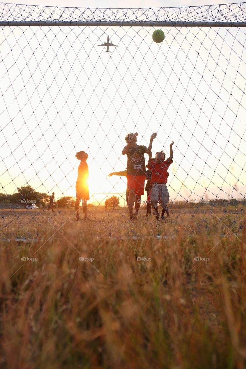 Playing football in the afternoon