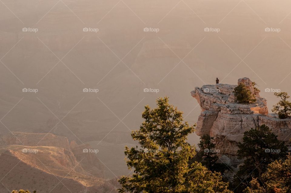 Lone hiker looking out over the Grand Canyon