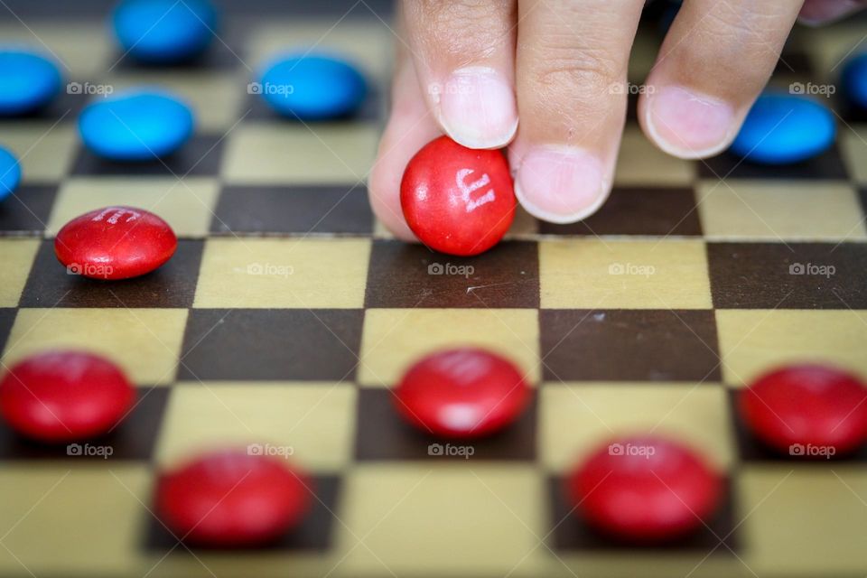 Playing checkers using candies