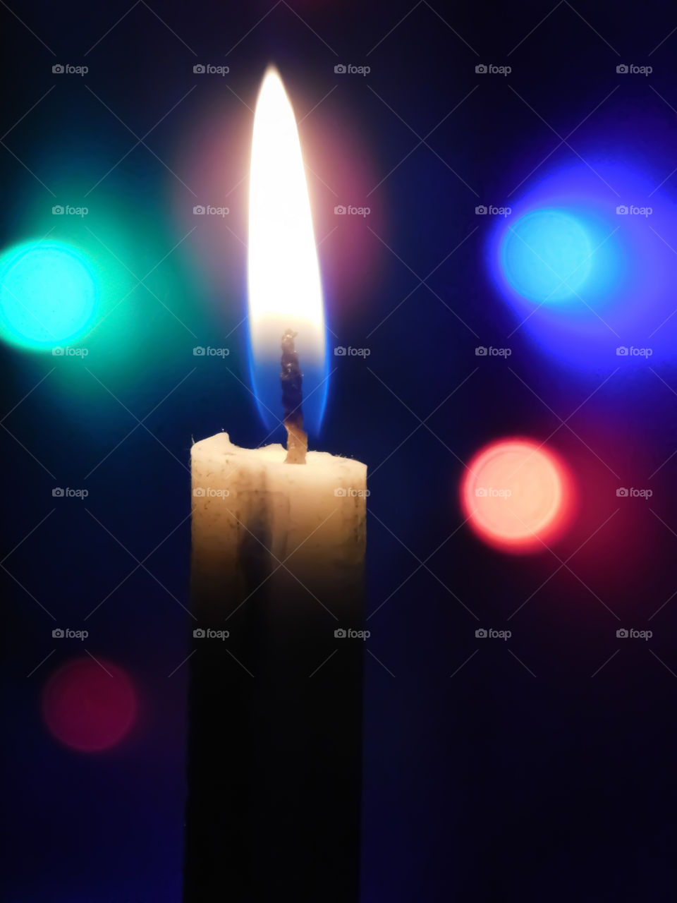 Candle with colourful bookeh effects