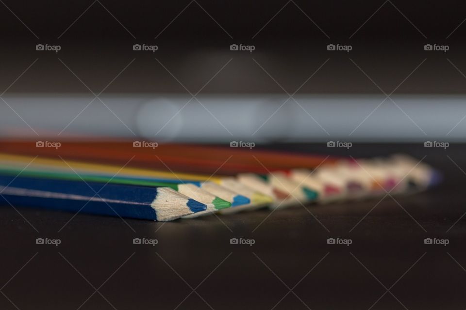 Colored pencils in a row