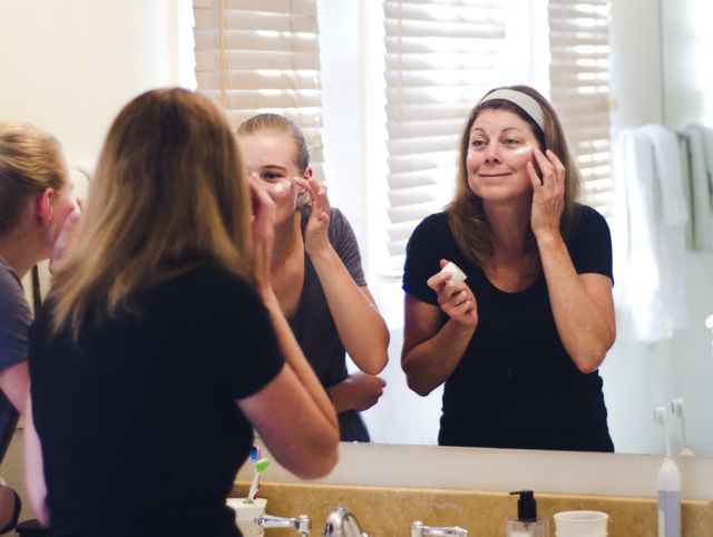 Mom and daughter enjoying refreshing facials