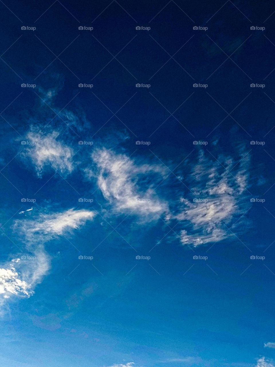 I want to show white clouds and blue sky in this photo.  The sky looks very beautiful with clouds and blue sky.