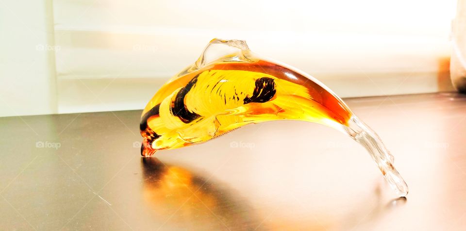 A pretty table decorative piece of a fish or dolphin looking great.