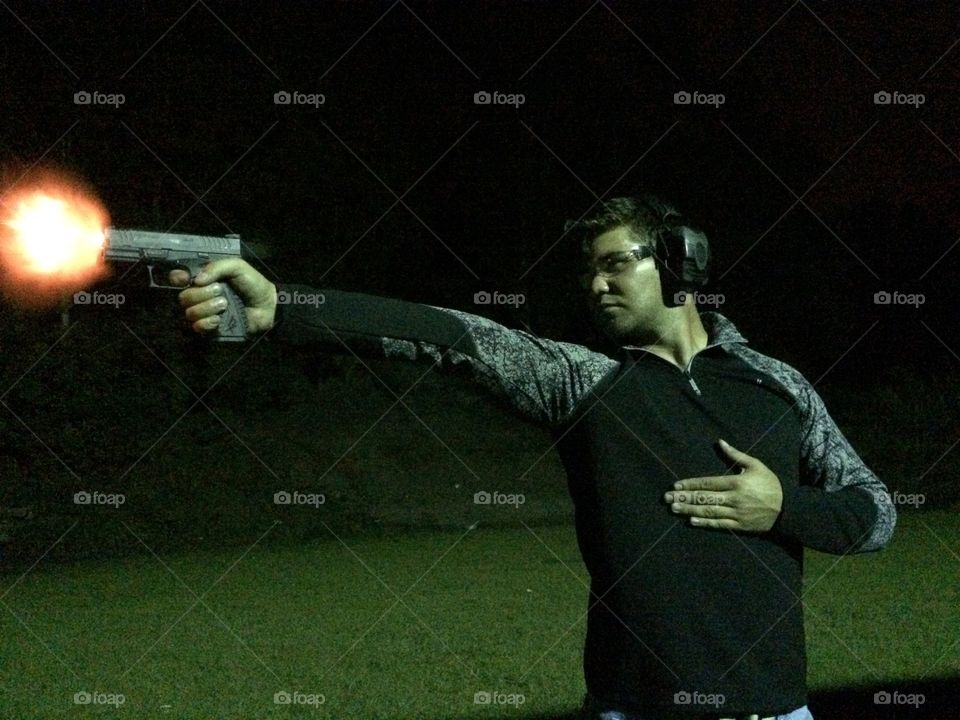 Close-up of man with gun