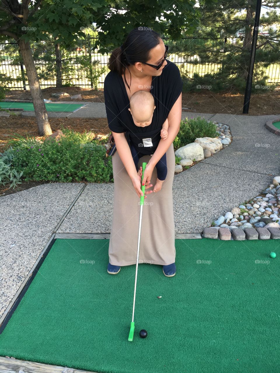 Miniature golfing with a baby