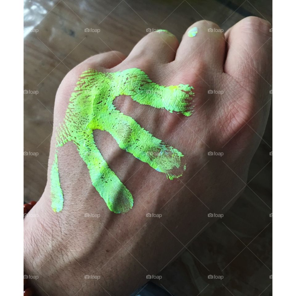 Touched by an alien. Tiny hand of paint