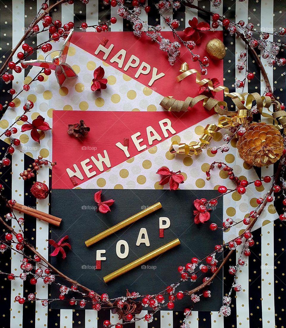 Red, black, white and gold Happy new year Foap flatlay composition