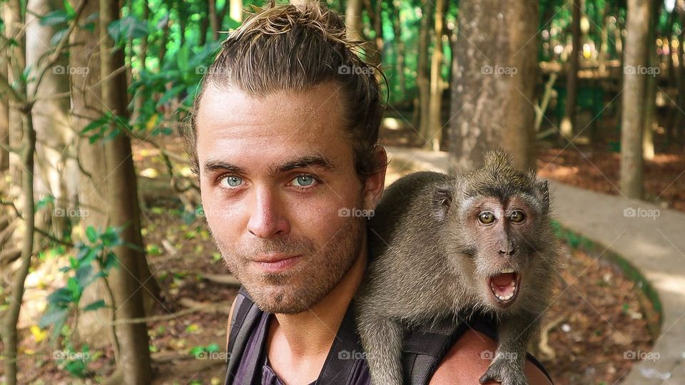 Hanging with my new friend in Ubud Monkey Forest in Ubud, Bali, Indonesia. The monkeys are fond of trying to break into backpacks and stealing!