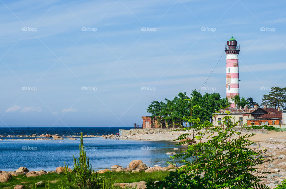 Lighthouse on the beach. Sunny day.