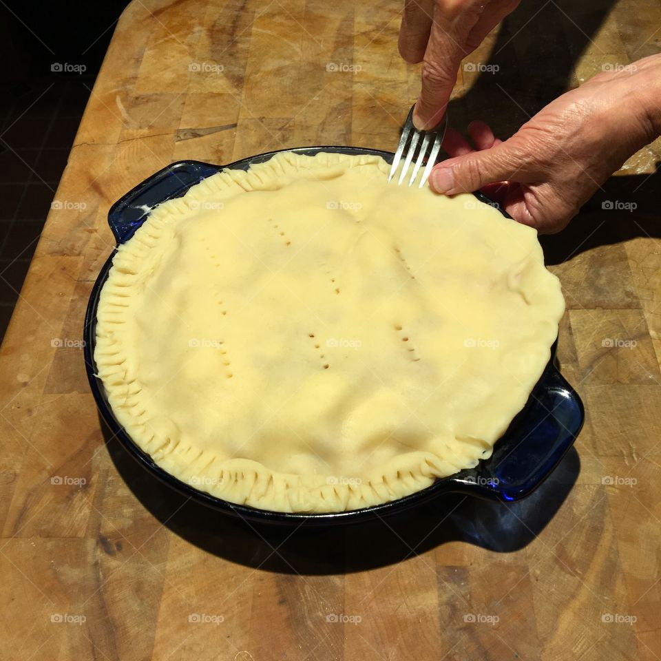 Crimping homemade pie crust with fork!