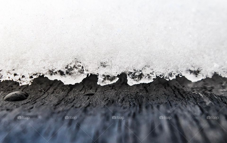 Closeup of a snowfall melting edge 