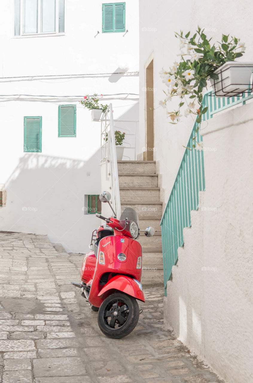 red bike on the white street