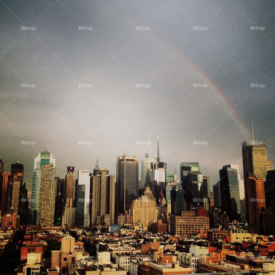 Rainbow over the Manhattan . Photo is taken in Manhattan New York after tropical rain. 