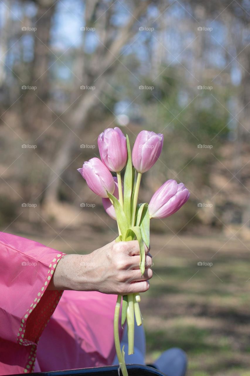 Woman holding an Early Spring Bouquet 