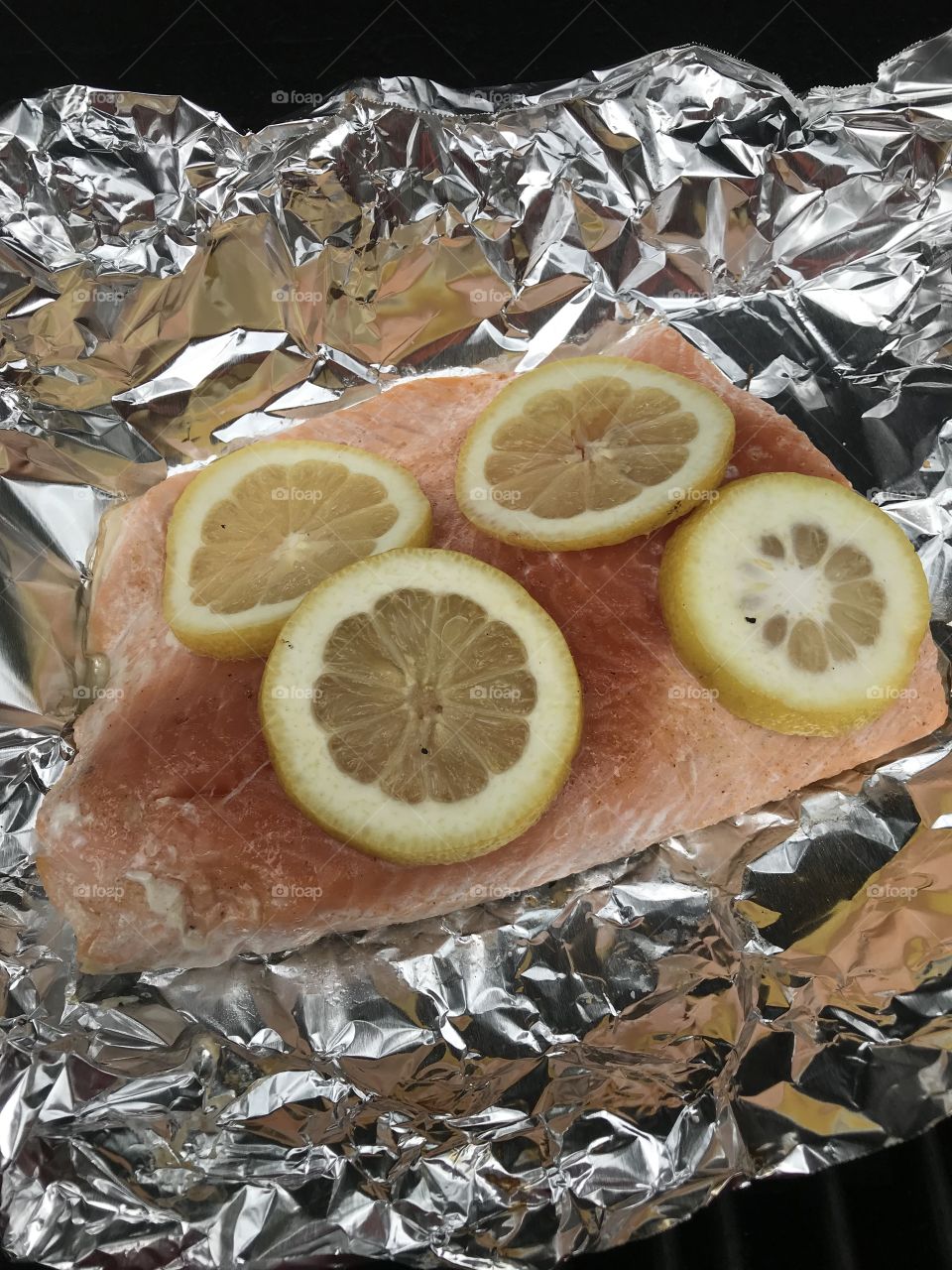 Fresh caught salmon cooking on the grill